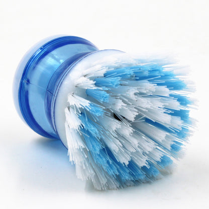 Dish brush with a detergent reservoir