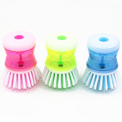 Dish brush with a detergent reservoir