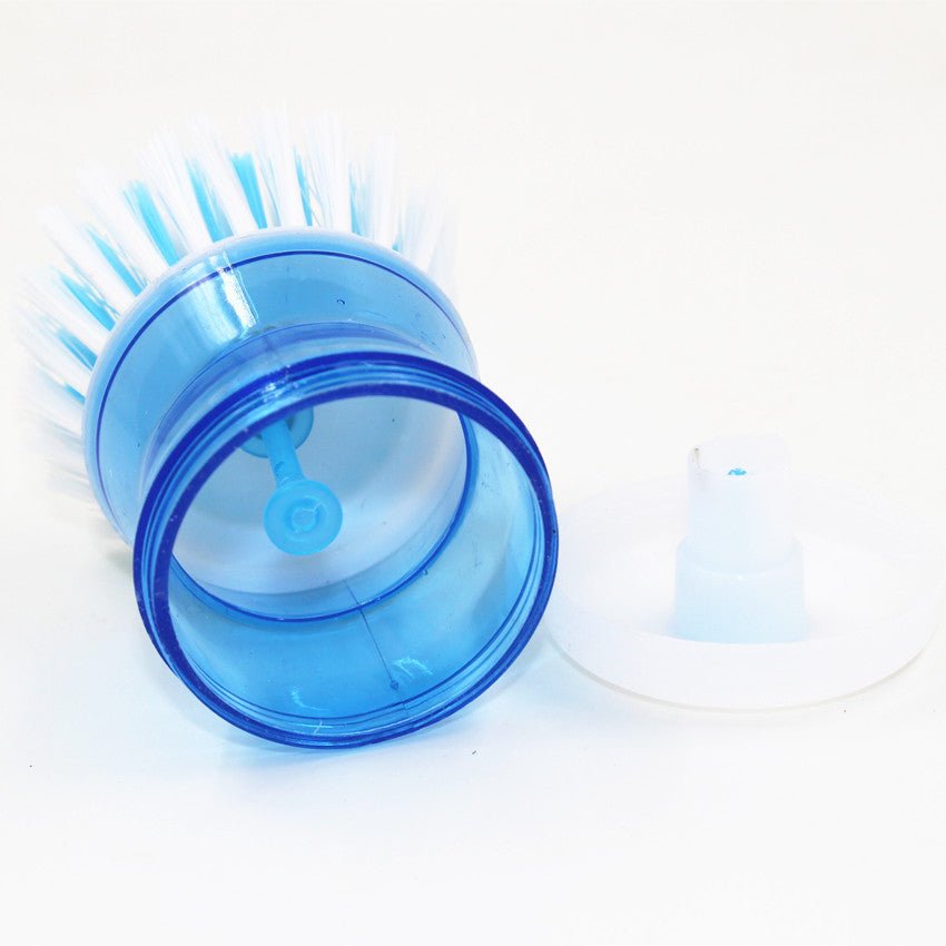 Dish brush with a detergent reservoir